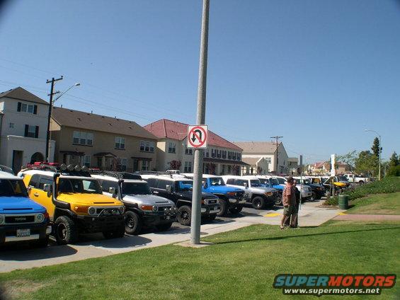 Yellow 2007 Toyota FJ Cruiser in a line of similar vehicles