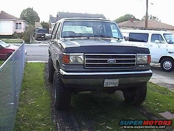 Lifted 1990 Ford Bronco front view with large tires