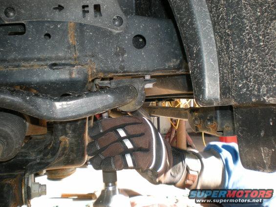 Front suspension part with FR marking and Supermotors.net logo