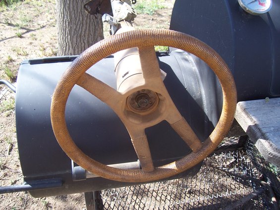 Steering wheel with woven grip