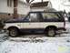 1988 Ford Bronco - 1988 Ford Bronco parked in a snowy yard.
