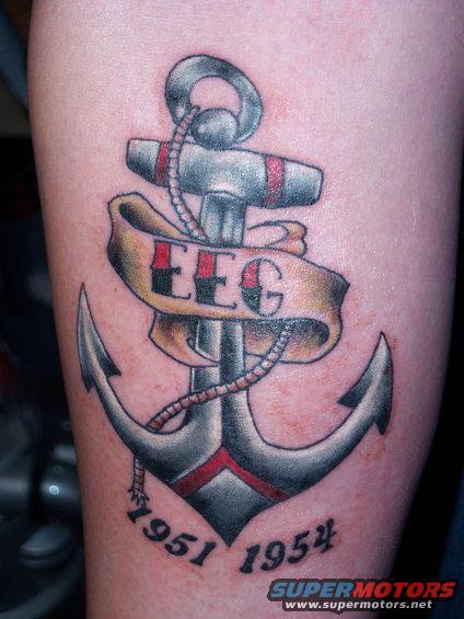 Tattoo of an anchor with a banner that says EEG. Dates 1951 and 1954 are below