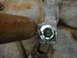 1996 Ford Bronco - A tool is used to work on a bolt, likely for a repair or removal.