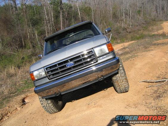 Silver 1989 Ford Bronco 4x4 on dirt road