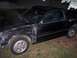 1987 Honda CRX - This black Honda CRX has a damaged front fender and door, with a leaf visible on the windshield.