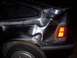 1987 Honda CRX - Rear quarter panel of a 1987 Honda CRX shows extensive damage, including dents and numerous scratches.