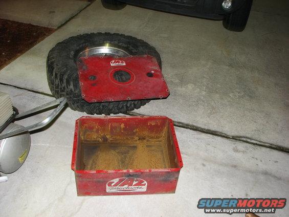 Red JAZ Products fuel cell and a spare tire with a red metal plate on top