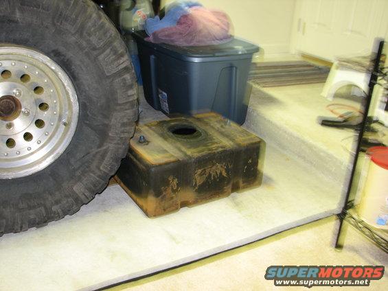 Fuel tank next to a large tire