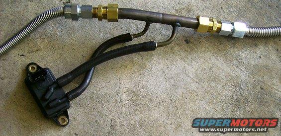 Exhaust pressure sensor connected to metal tubing and flexible hose