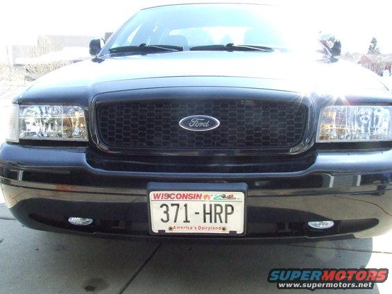 Front view of a black 2003 Ford Crown Victoria with a Wisconsin license plate