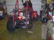 2003 Yamaha RAPTOR 660 - ATV chassis suspended for work in a garage setting. The engine and rear axle are exposed.