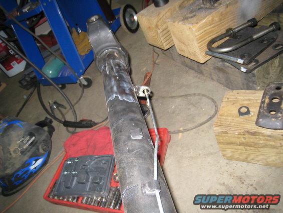 Driveshaft with visible welding and a cable guide