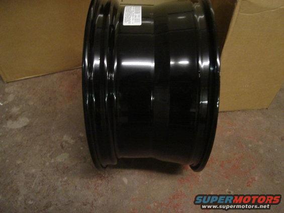 black steel wheel rim with a sticker on the side