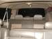2003 Ford Excursion - Rear interior view of a 2003 Ford Excursion, dual-tone leather seats and overhead lighting.