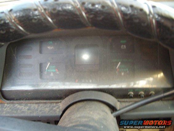 Dashboard gauges with oil, amp, and fuel indicators visible