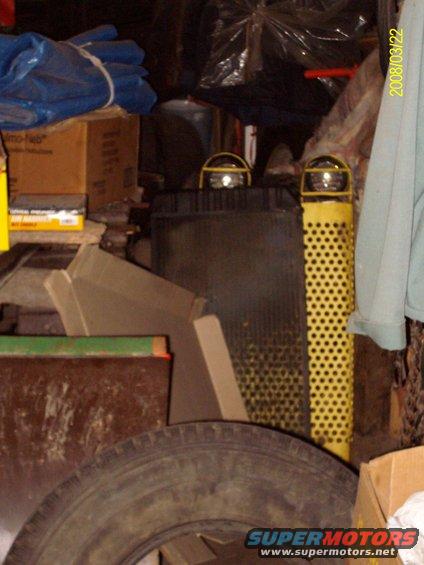 crawlers-custom-front-guard.jpg Grill guard painted yellow with the lights on it.
