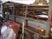 1988 Ford Bronco - This old truck bed is covered in snow and appears to be in disrepair.