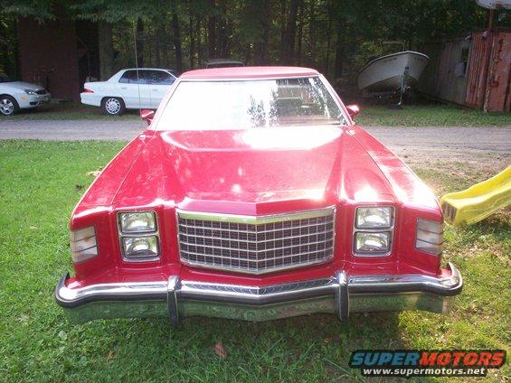 Red 1979 Ford Ranchero front view with chrome grille and quad headlights