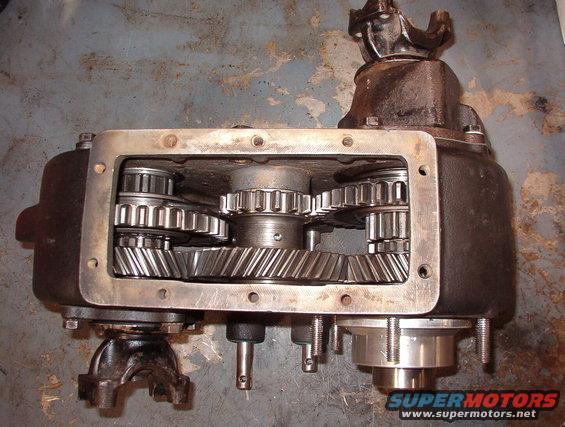 24lo2wd.jpg 2WD Low
The rear output sliding gear is full rearward (low-range).  The pills prevent the front output shift rail from moving forward (to high) but allow it to move rearward to front (4) low.

The Aluminum sleeve & stub shaft at the lower R are for the Advance Adapters kit for the AOD.  Removing that shaft from the t-case allows about a dozen roller bearings to fall loose into & out of the t-case.  Finding & re-installing them is a challenge.
