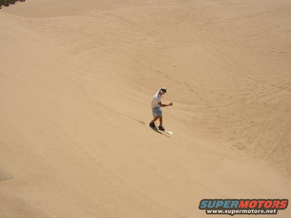 pismo_005.jpg Riding an old snow board in sand