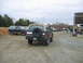1992 Ford Mustang - Several Ford Broncos and other vehicles are parked in a lot on a cloudy day.