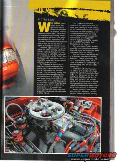 Engine bay of a red Ford Mustang, showing a large carburetor and various hoses and wires
