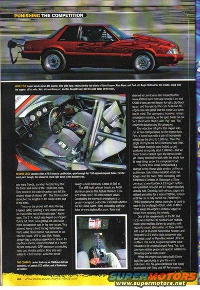 Red drag car with flame decals, roll cage, and racing interior