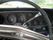1975 Ford Ranchero - The interior of a classic car features a dashboard with multiple gauges and a vintage radio.