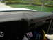 1975 Ford Ranchero - The interior of a vehicle shows a worn dashboard with visible cracks and repairs.