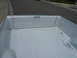 1975 Ford Ranchero - Interior view of a pickup truck bed, showing the ribbed floor and side panels.