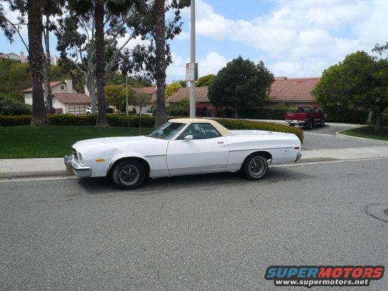 White 1975 Ford Ranchero parked on a residential street, side view
