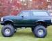 1994 Ford Bronco - This modified Ford Bronco has a lifted suspension and oversized tires, suggesting a model year between 1992 and 1996.