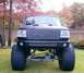 1994 Ford Bronco - This lifted 1994 Ford Bronco features a custom grille and oversized tires, giving it an imposing stance.
