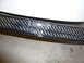 1996 Ford Probe - A close-up view of a damaged carbon fiber trim piece.