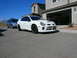 1996 Ford Probe - White Dodge Neon SRT-4 parked in a driveway, with a blue minivan behind it.