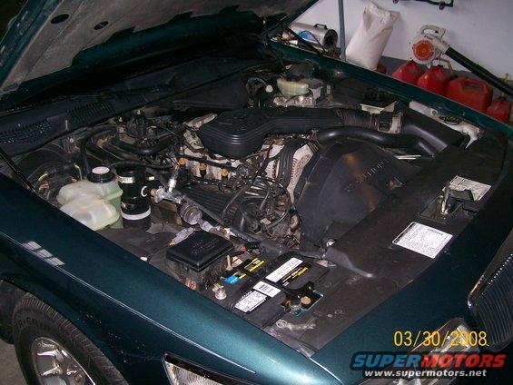 Green 1995 Mercury Grand Marquis engine bay with hood open