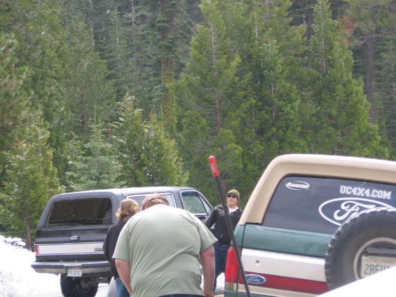 Rear view of a tan and green Ford Bronco with UC4X4.COM sticker and spare tire