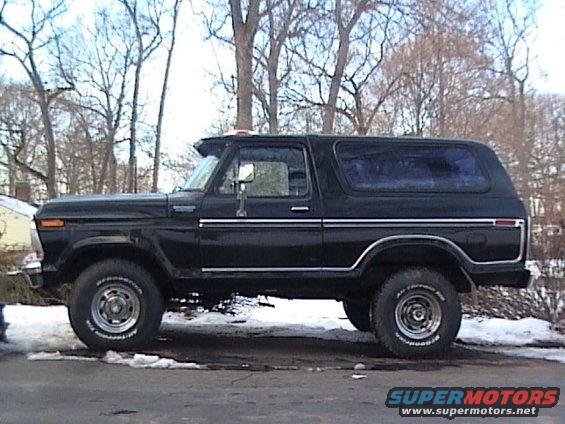 Side view of a black Ford Bronco with chrome trim and BFGoodrich tires