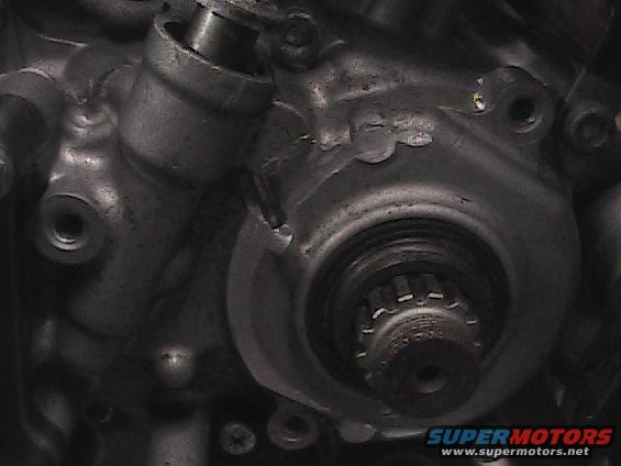 Close-up of motorcycle engine part with splined shaft