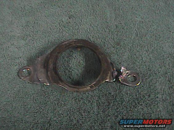 Damaged metal bracket with a circular opening and a broken piece