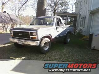 1983 Ford Bronco, 3q front view, silver and blue