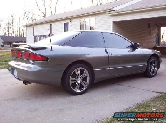 Gray 1995 Ford Probe 3q-front view with spoiler and aftermarket wheels