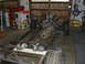 1964 Ford Ranchero - Engine and chassis components are laid out in a garage, with turbochargers visible on a plank.