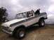 1978 Ford Bronco - This two-tone 1978 Ford Bronco is shown off-road with children enjoying the ride.