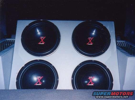 415s.jpg Four 15" Kicker XPL subs in back of my 94 