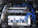 1992 Ford Taurus - Close-up view of a V6 engine bay, showing spark plug wires and engine components.