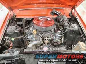 Engine bay with red air cleaner and visible text 'SUPER MOTORS'