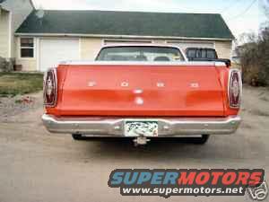 Rear view of an orange 1969 Ford Ranchero pickup with a trailer hitch