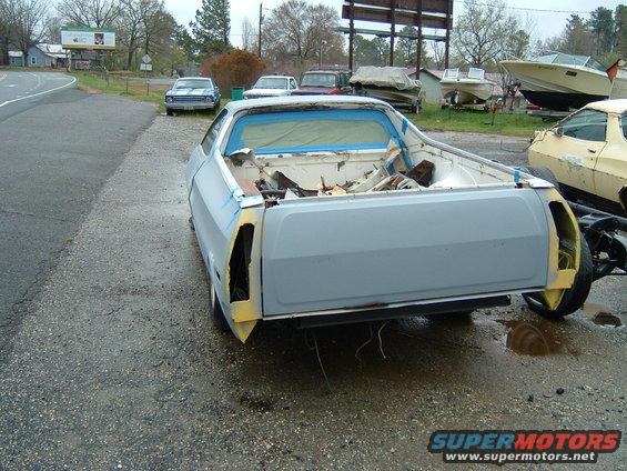1979 Ford Ranchero rear view, primer bodywork, blue masking tape on windows