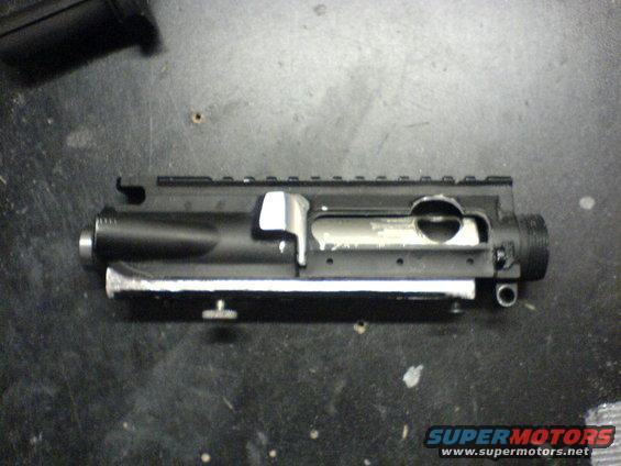 AR-15 upper receiver with charging handle visible